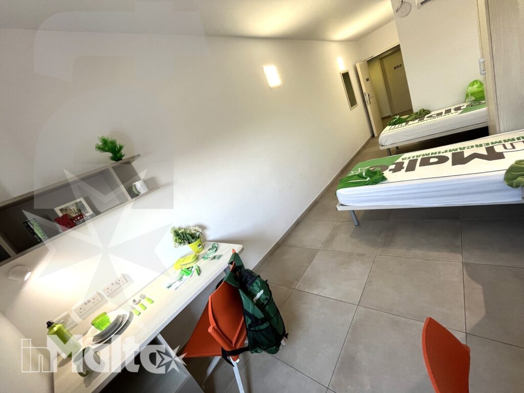Twin room with study area - Campus inMalta Twin room at Campus inMalta with single bed, desk and wardrobe
