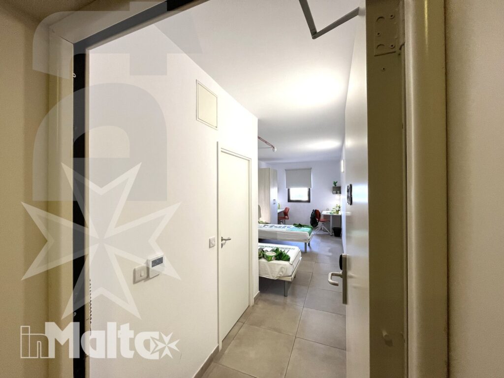 Entrance and wardrobes in the twin room - Campus inMalta Entrance to the twin room at Campus inMalta with wardrobes and beds